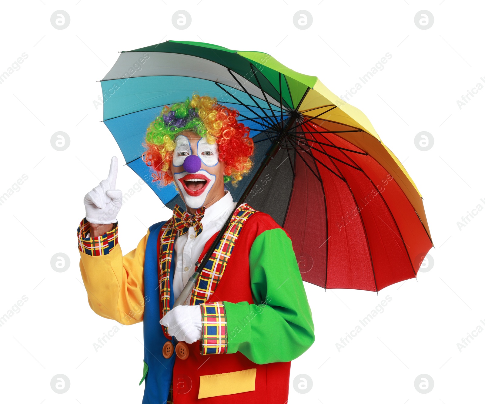 Photo of Happy clown with colorful umbrella on white background