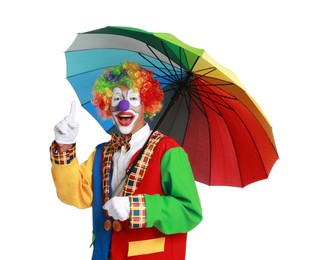 Happy clown with colorful umbrella on white background