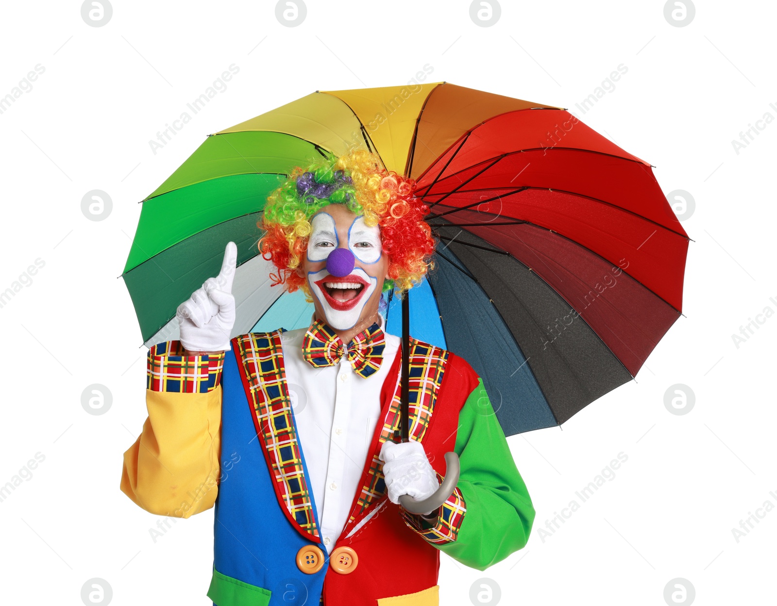 Photo of Happy clown with colorful umbrella on white background