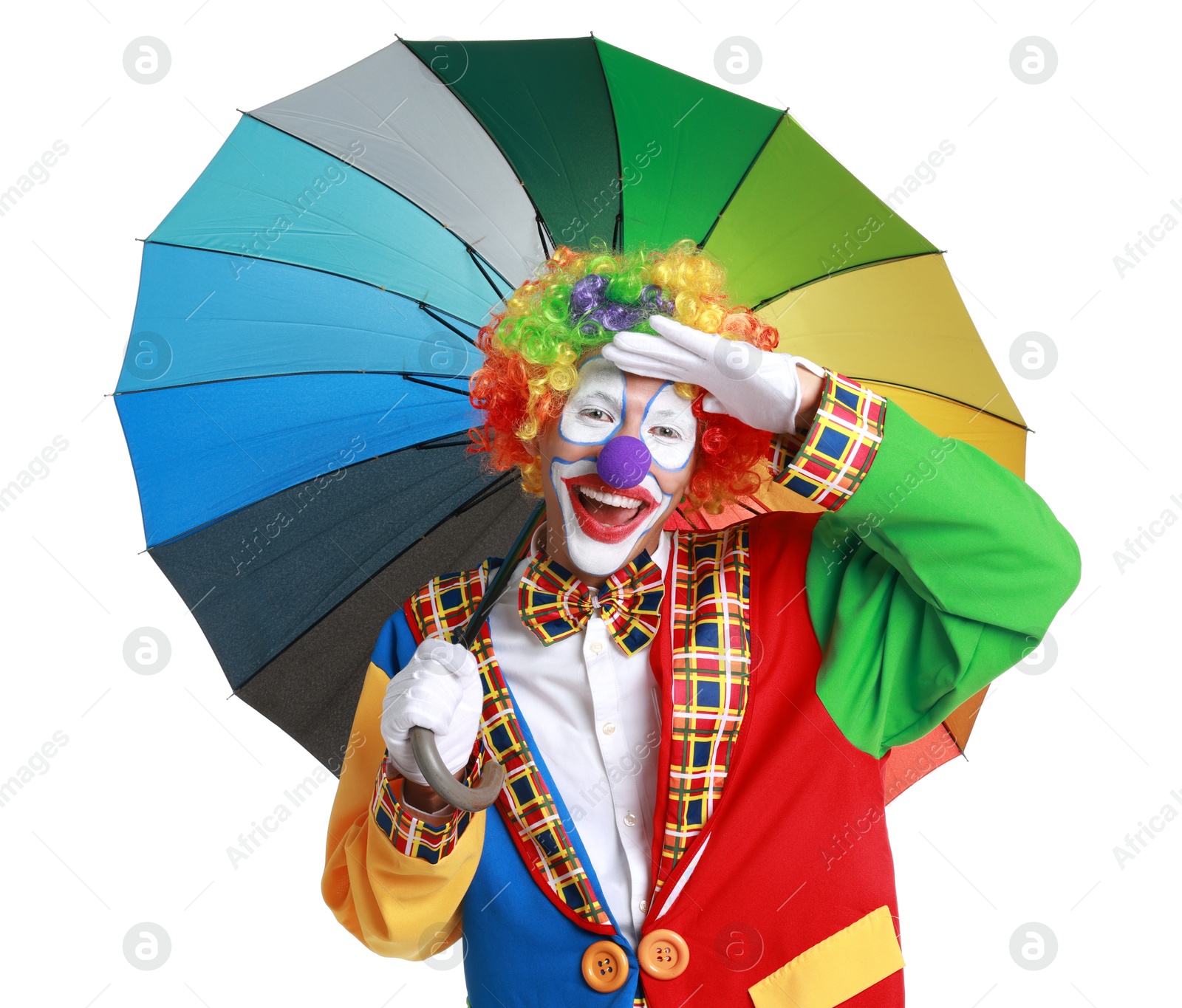 Photo of Happy clown with colorful umbrella on white background