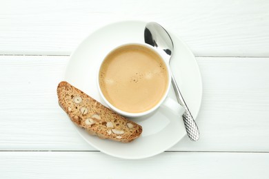 Traditional Italian almond biscuit (Cantucci) and coffee on white wooden table, top view