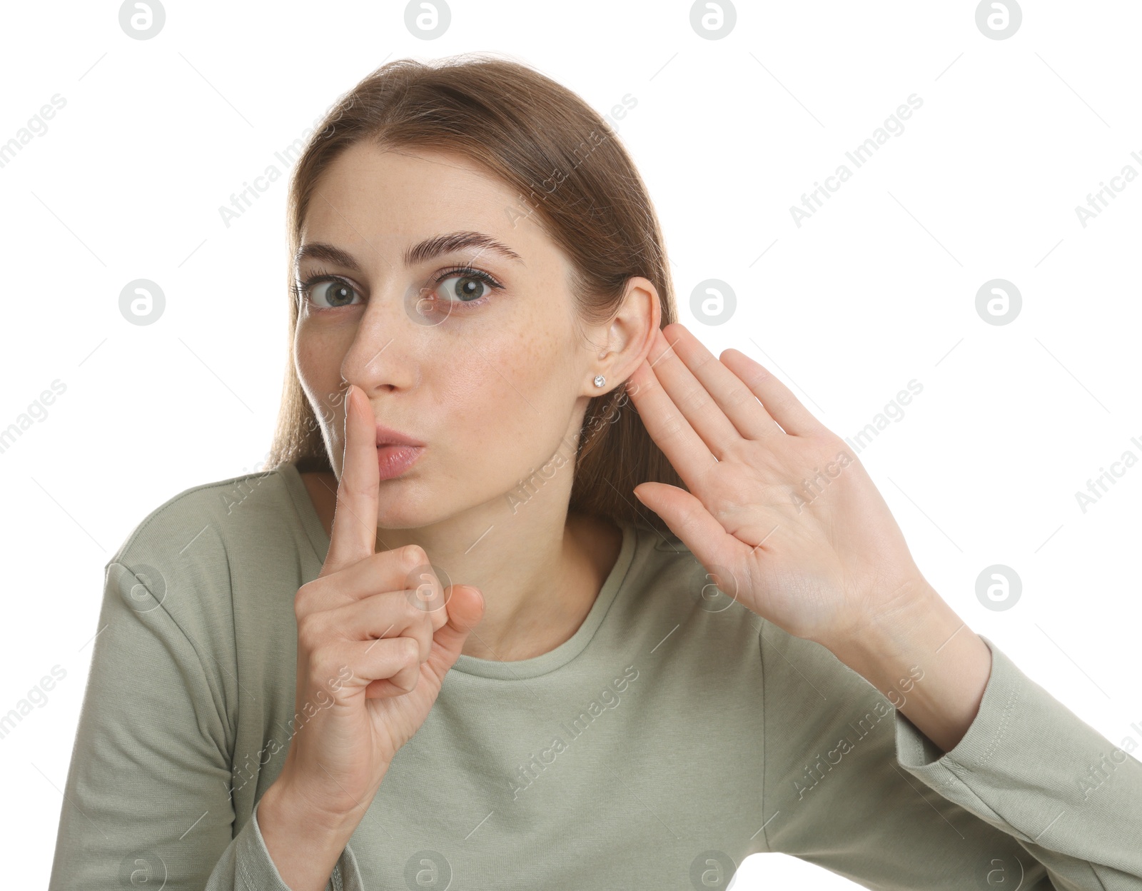 Photo of Woman showing hand to ear gesture on white background