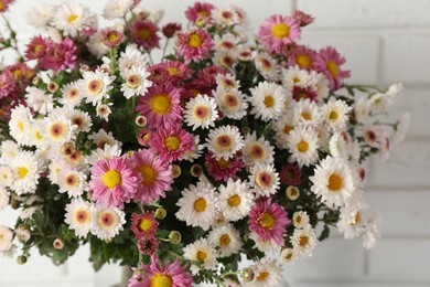 Photo of Beautiful white and pink flowers on light background, closeup