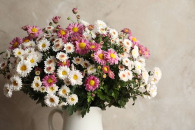 Photo of Vase with beautiful flowers on gray background, closeup