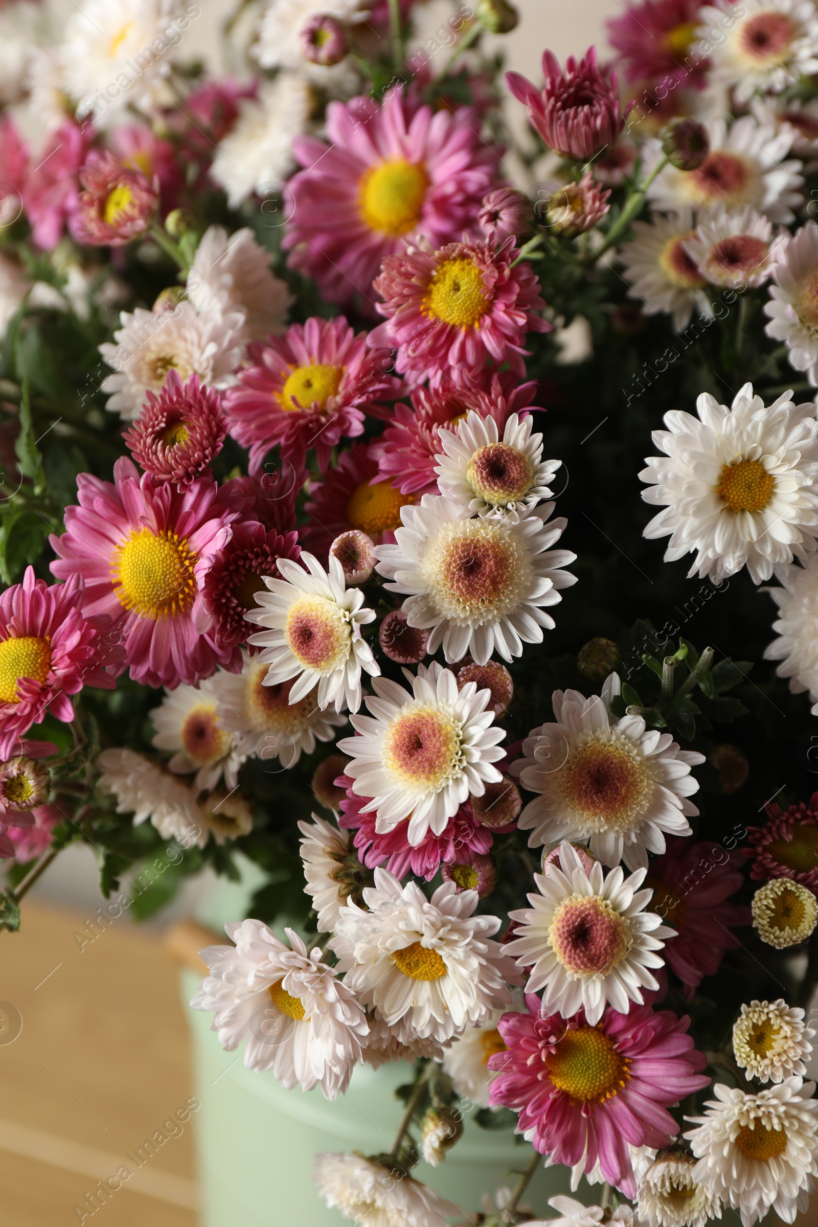 Photo of Beautiful flowers in vase on table, closeup