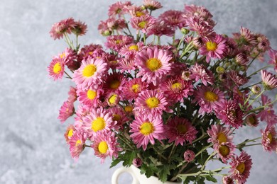 Photo of Beautiful chrysanthemum flowers on grey background, closeup