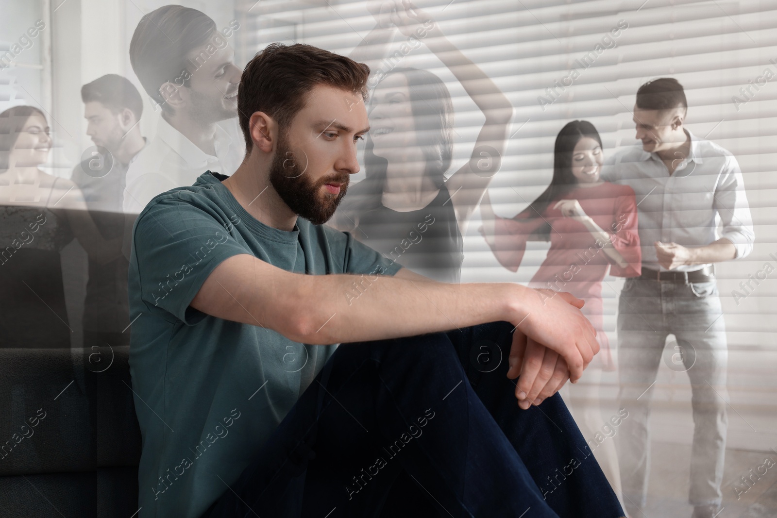 Image of Loneliness. Sad man sitting in room and group of friends at party, double exposure