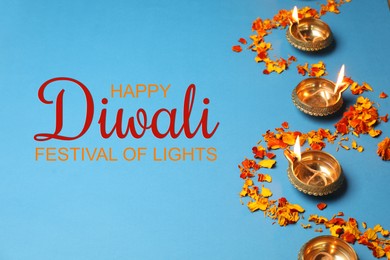 Image of Happy Diwali greeting card, Hindu festival of lights. Diya lamps and marigold petals on light blue background