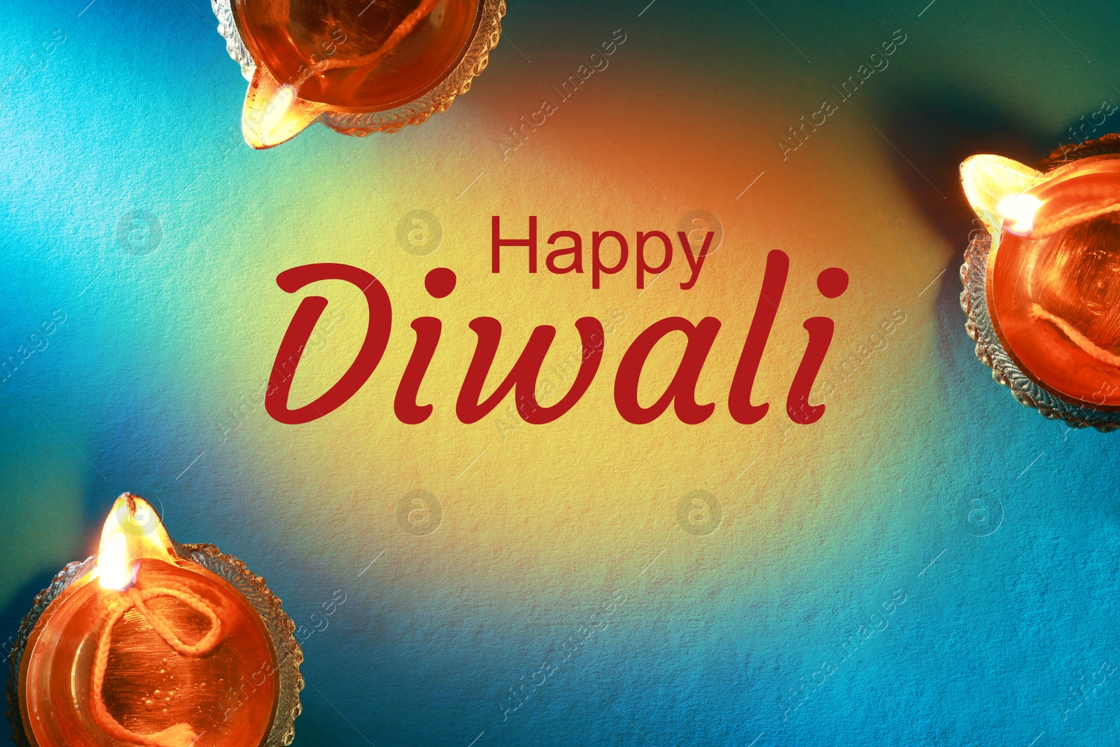 Image of Happy Diwali greeting card, Hindu festival of lights. Diya lamps on teal background, flat lay