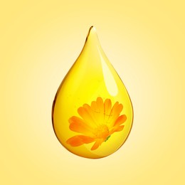 Image of Calendula essential oil drop with flower inside on golden background