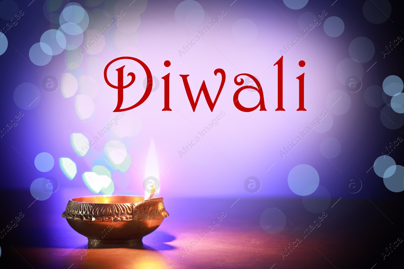 Image of Happy Diwali greeting card, Hindu festival of lights. Diya lamp on color background with blurred lights, closeup