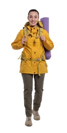 Photo of Smiling young woman with backpack walking on white background. Active tourism