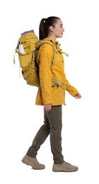 Young woman with backpack walking on white background. Active tourism