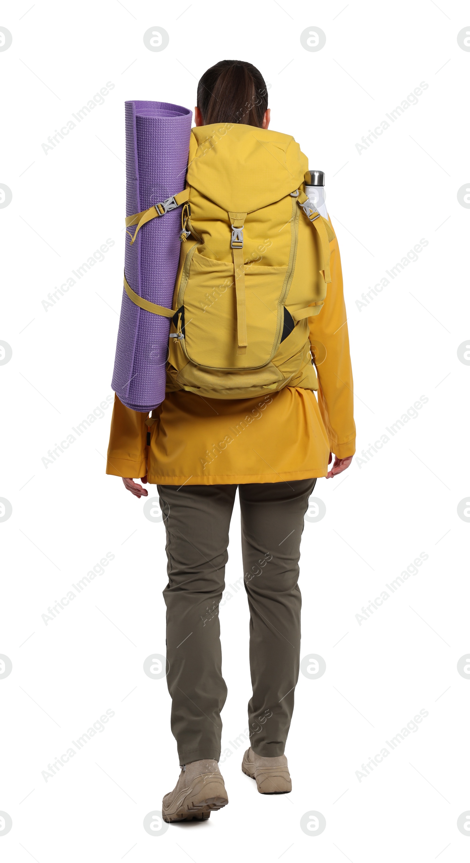 Photo of Woman with backpack and mat walking on white background, back view. Active tourism