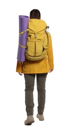 Photo of Woman with backpack and mat walking on white background, back view. Active tourism