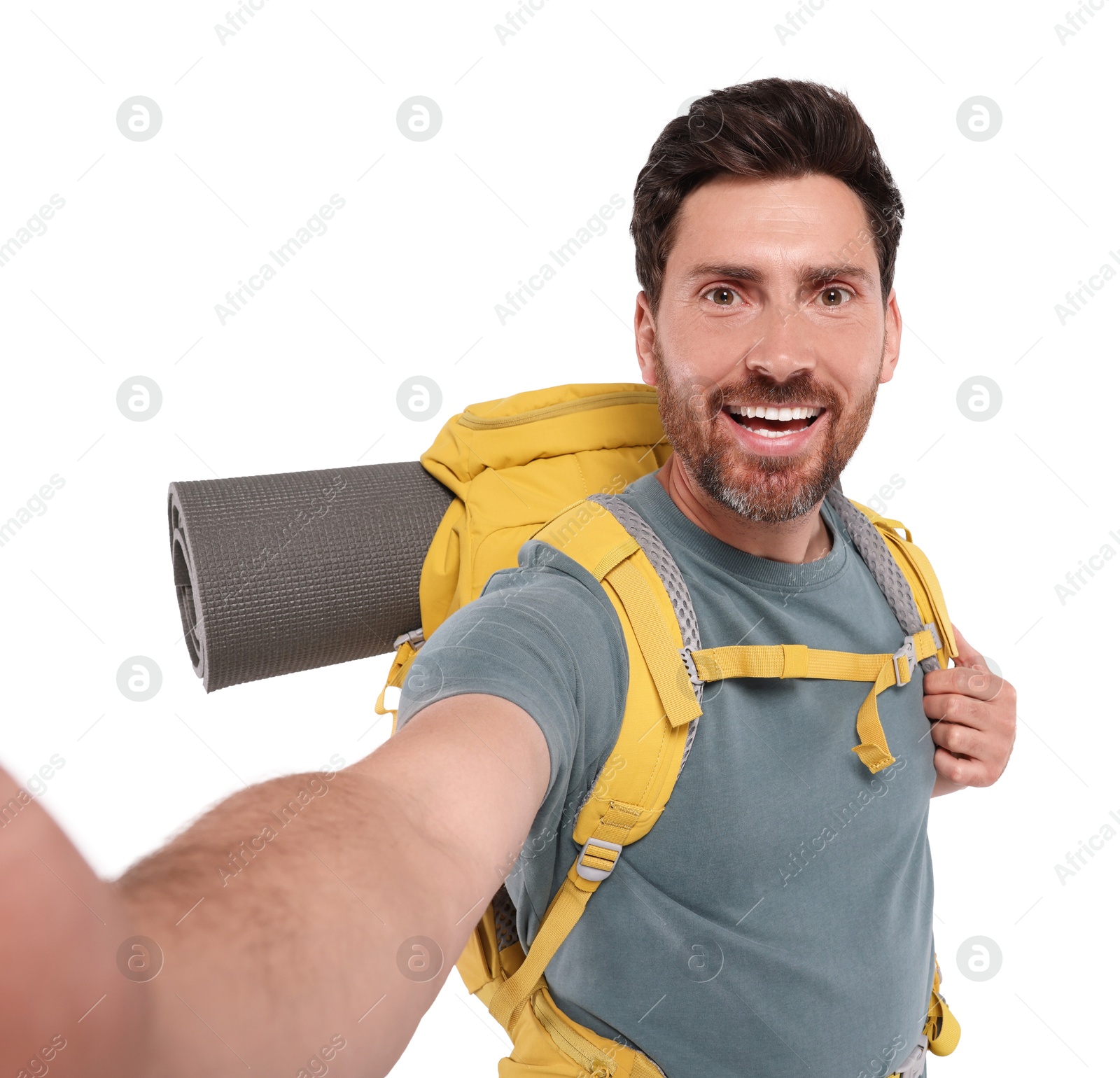 Photo of Happy man with backpack taking selfie on white background. Active tourism