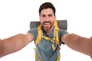 Photo of Happy man with backpack taking selfie on white background. Active tourism