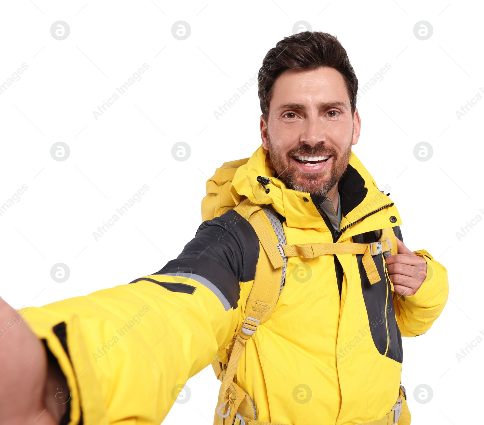 Photo of Happy man with backpack taking selfie on white background. Active tourism