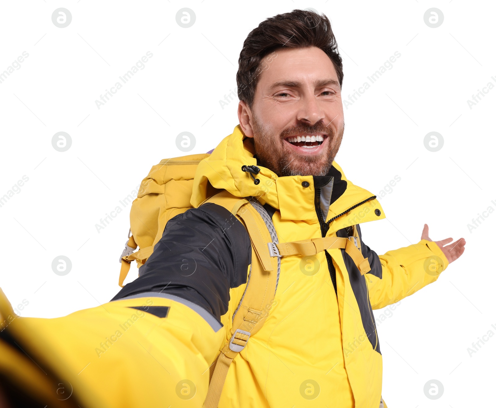 Photo of Happy man with backpack taking selfie on white background. Active tourism