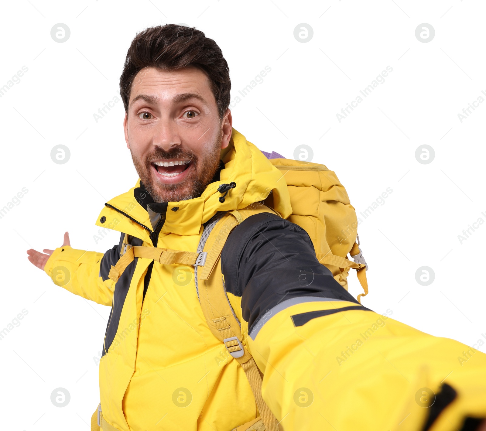 Photo of Happy man with backpack taking selfie on white background. Active tourism