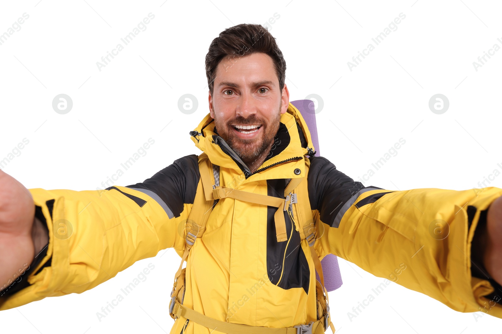 Photo of Happy man with backpack taking selfie on white background. Active tourism