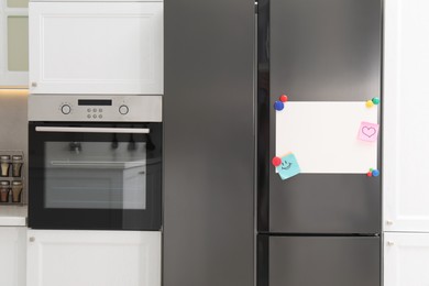 Blank magnetic board with notes on refrigerator in kitchen