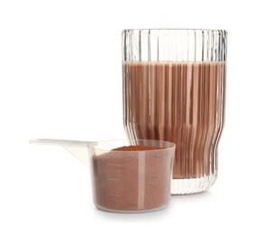 Photo of Delicious protein shake in glass and scoop with powder isolated on white