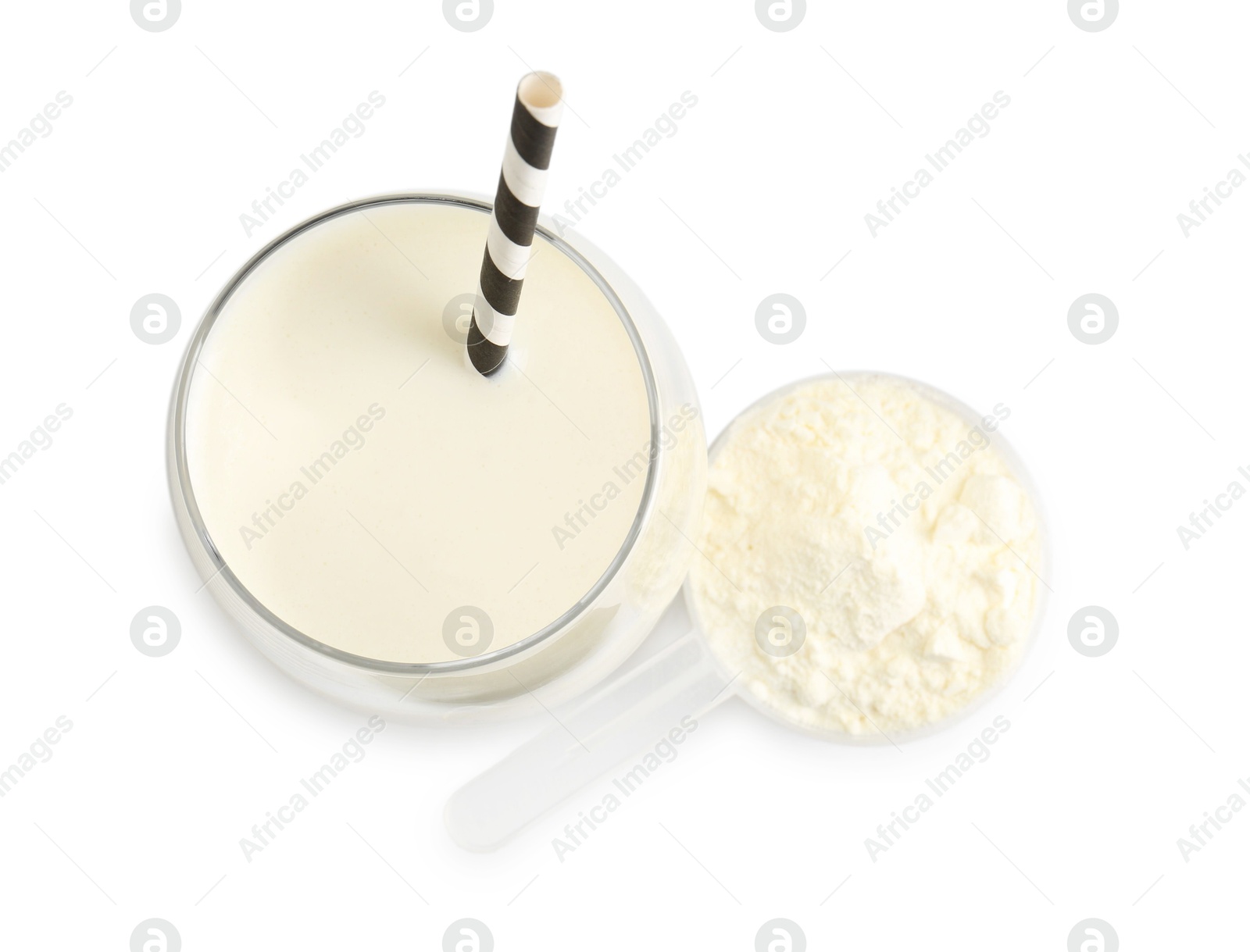 Photo of Delicious protein shake in glass and scoop with powder isolated on white, top view