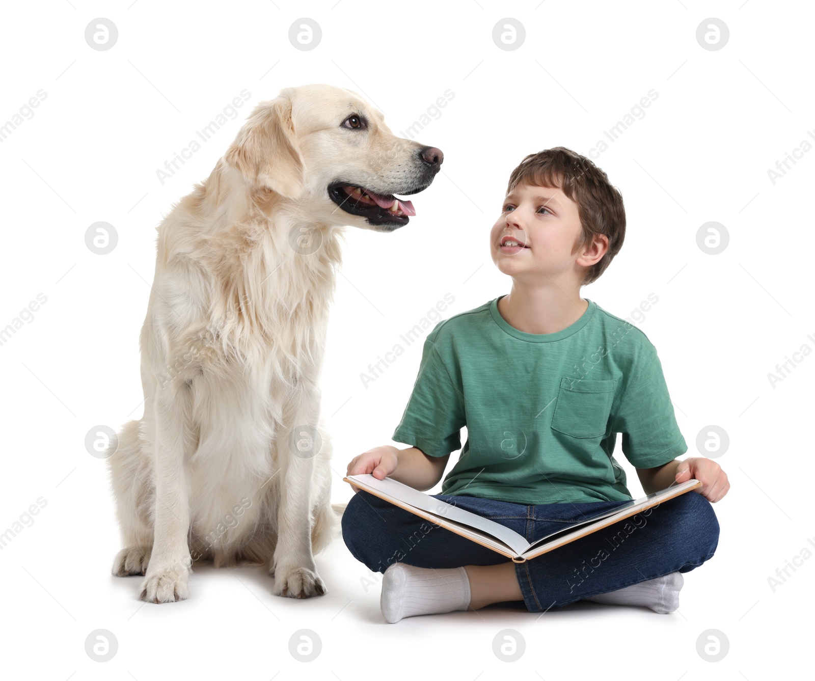 Photo of Boy reading book with his cute dog on white background