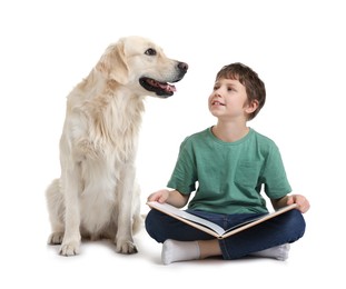 Photo of Boy reading book with his cute dog on white background