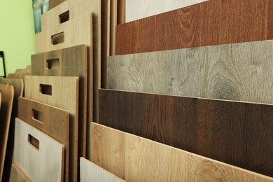 Photo of Many different samples of wooden flooring in store