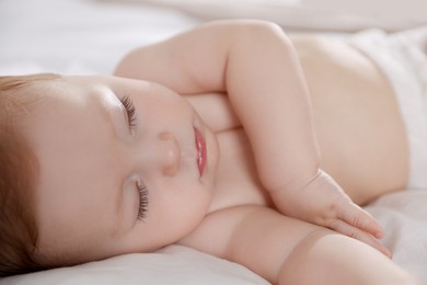 Photo of Cute little baby sleeping on bed at home