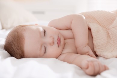 Photo of Cute little baby sleeping on bed at home