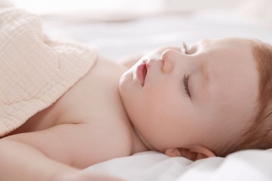 Photo of Cute little baby sleeping on bed at home