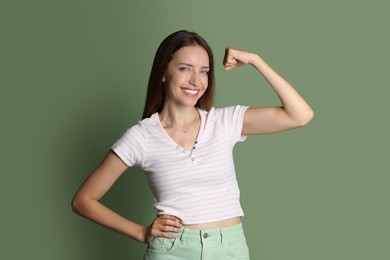 Portrait of happy winner on green background