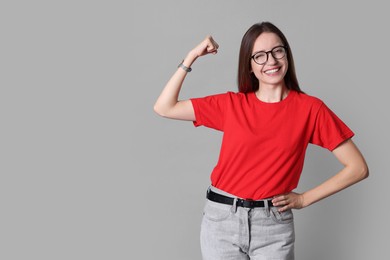 Photo of Happy winner on gray background, space for text