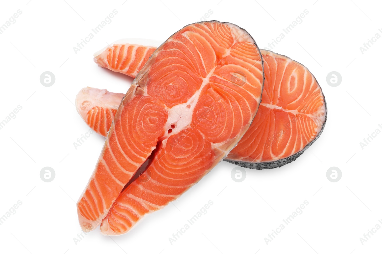 Photo of Steaks of fresh raw salmon isolated on white, top view