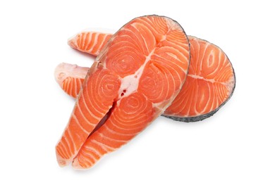 Photo of Steaks of fresh raw salmon isolated on white, top view