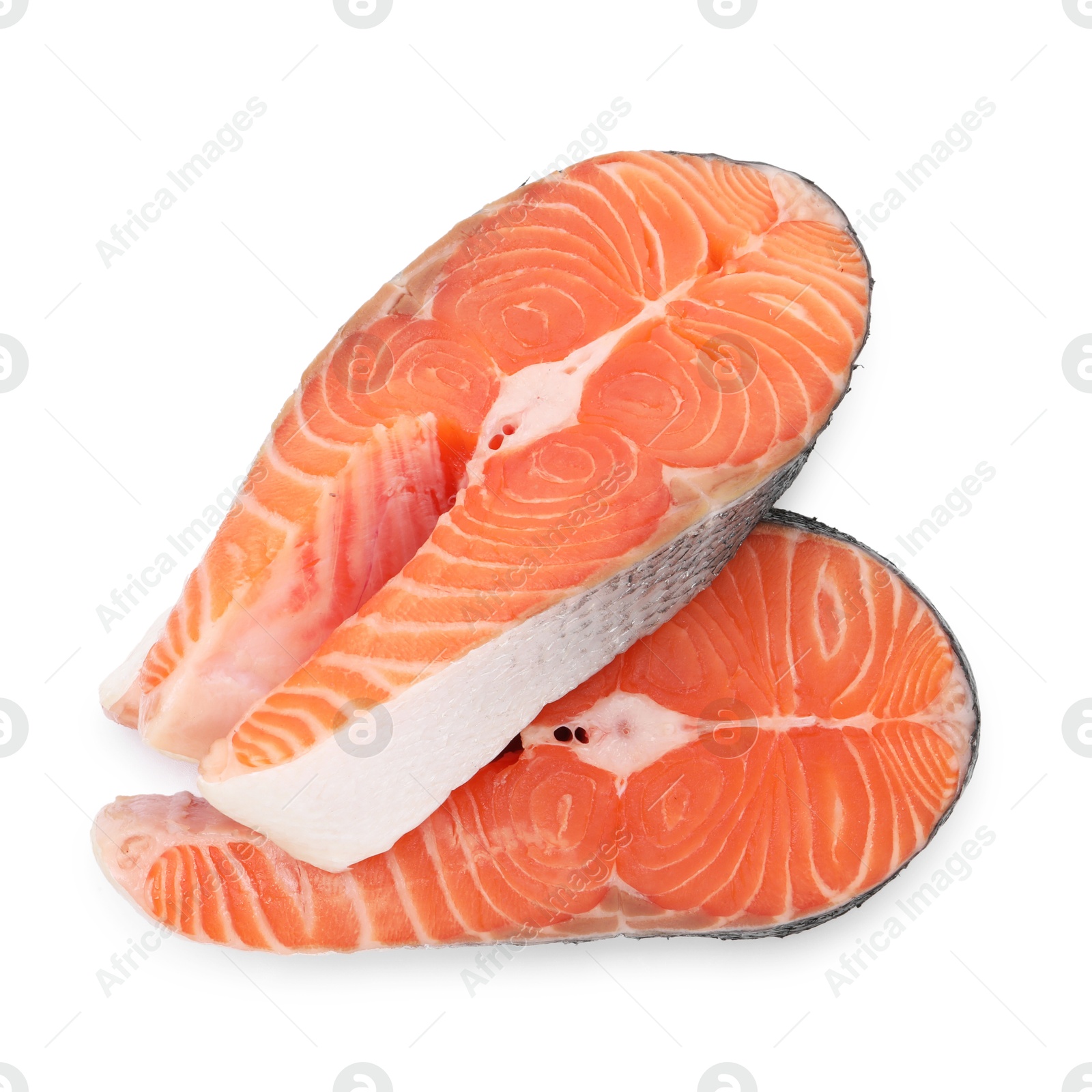 Photo of Steaks of fresh raw salmon isolated on white, top view