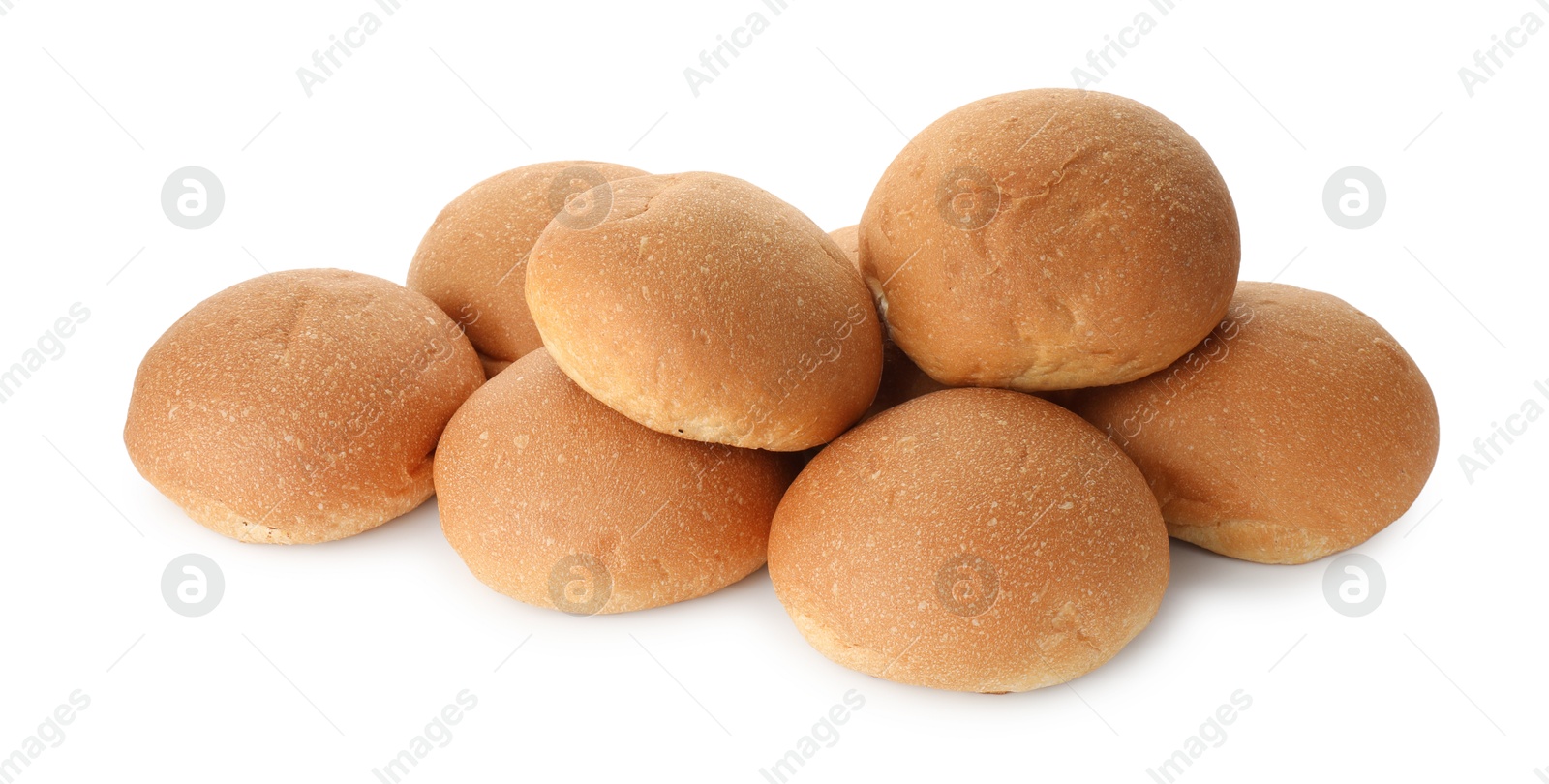 Photo of Many fresh tasty buns isolated on white