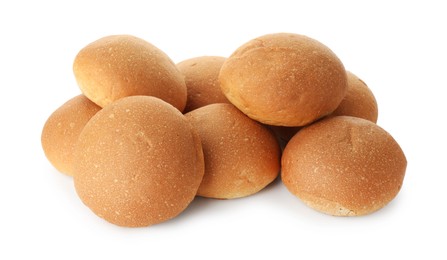 Photo of Many fresh tasty buns isolated on white