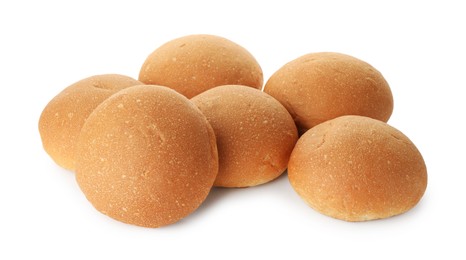 Photo of Many fresh tasty buns isolated on white