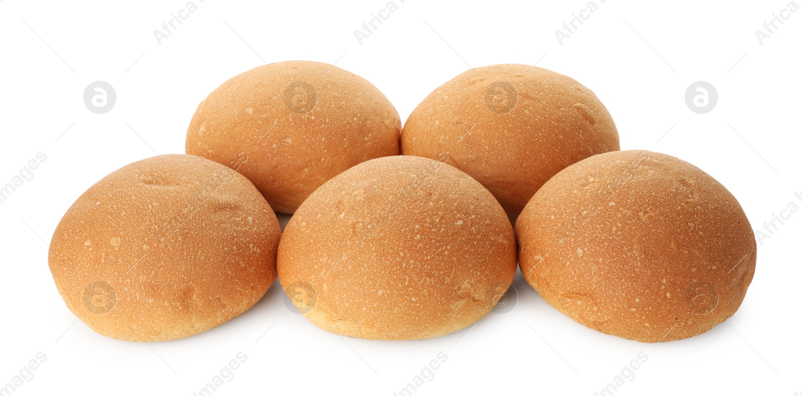 Photo of Many fresh tasty buns isolated on white