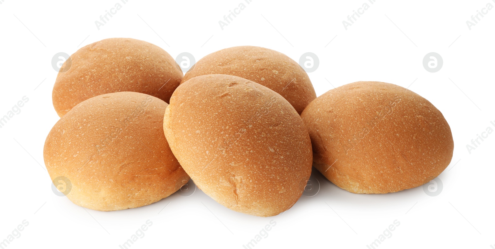 Photo of Many fresh tasty buns isolated on white