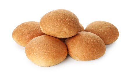 Photo of Many fresh tasty buns isolated on white