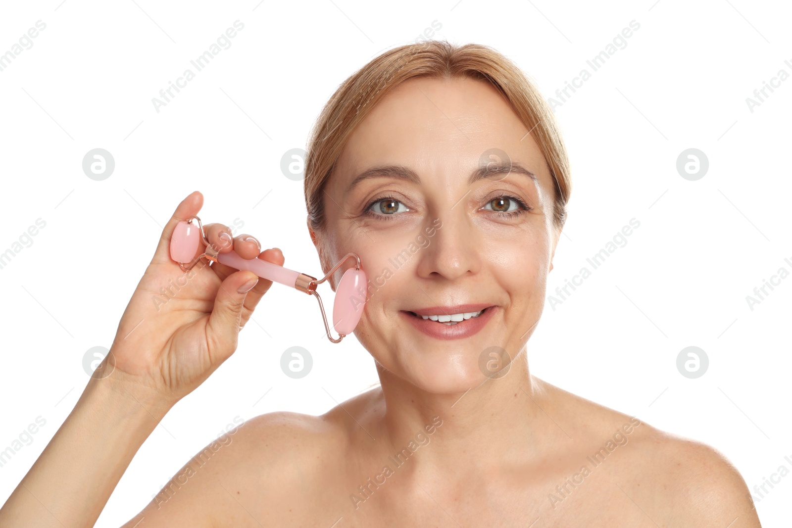 Photo of Smiling woman doing facial self massage with roller on white background