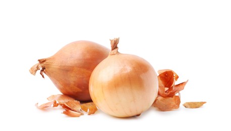 Photo of Fresh onions with peels isolated on white