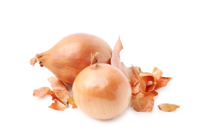 Photo of Fresh onions with peels isolated on white