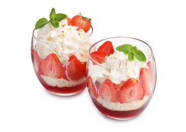 Photo of Tasty trifle dessert. Sponge cake, strawberries, jam and whipped cream in glasses isolated on white