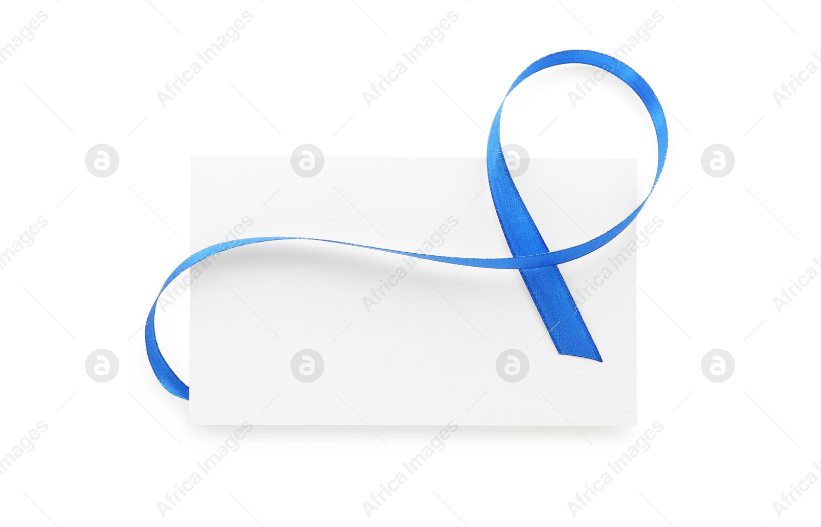 Photo of Blank card and blue ribbon isolated on white, top view